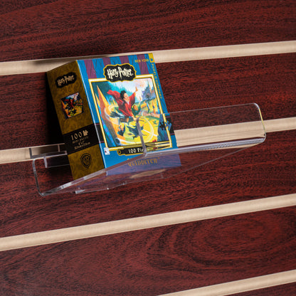 This clear acrylic shelf is great for highlighting an individual book, DVD, game or other item on slatwall.