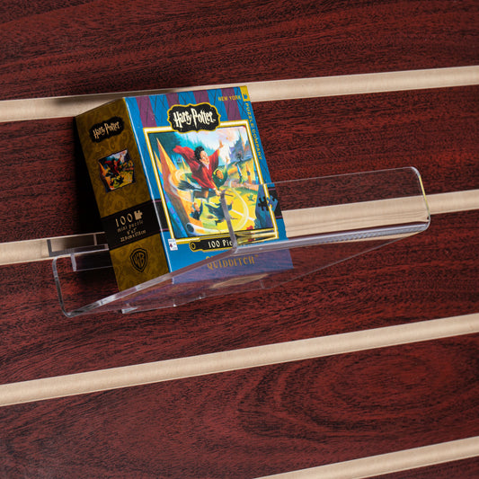 This clear acrylic shelf is great for highlighting an individual book, DVD, game or other item on slatwall.